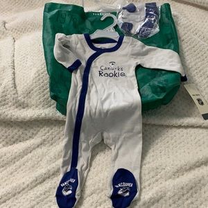Brand new never worn 3-6 month Canucks onesie